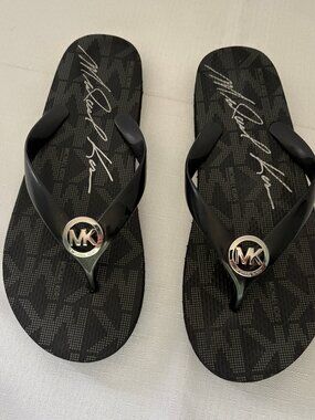 MICHAEL KORS Black with Silvertone Logo Flip Flops Sandals